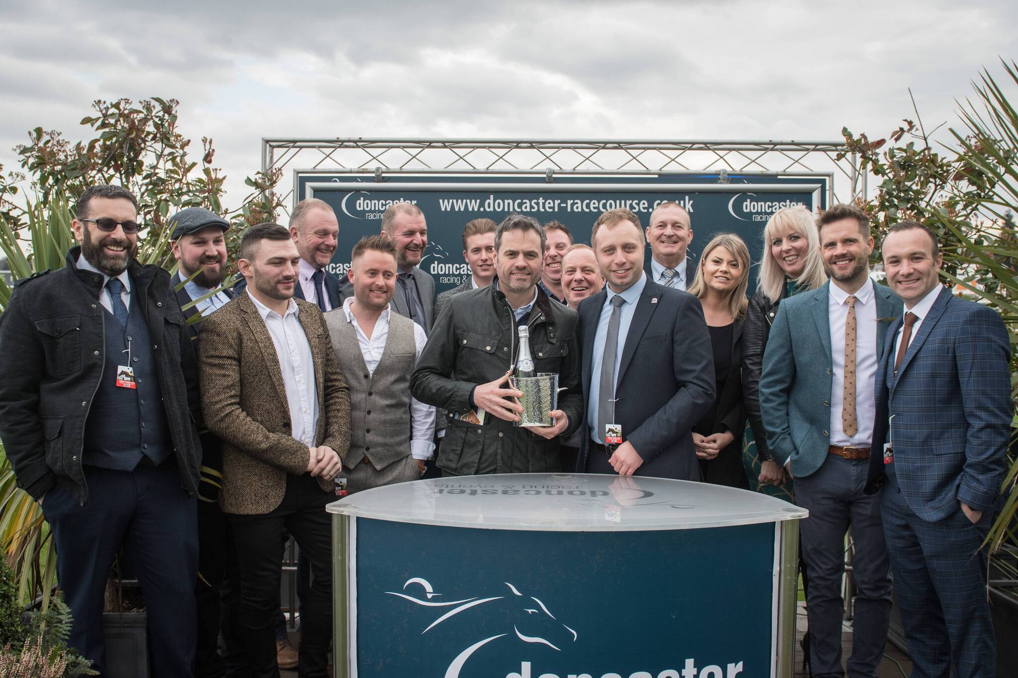 MKM Branch Director Glenn Paddison is pictured presenting the trophy to Charlie along with Hannah, Liz and the rest of the team from the MKM branch.